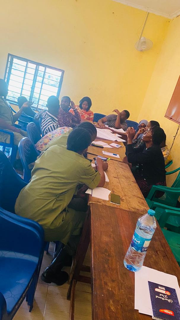 Women and community members share ideas during a discussion
