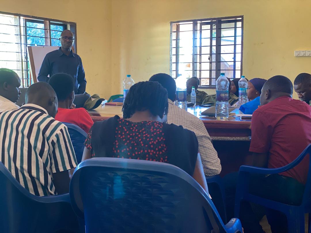 A facilitator shares information at a community rights workshop.