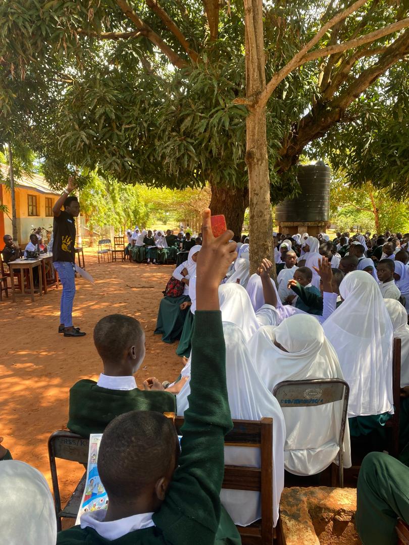 Students participate in an outdoor school discussion.